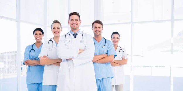 Portrait of confident happy group of doctors standing at the medical office-498102-edited